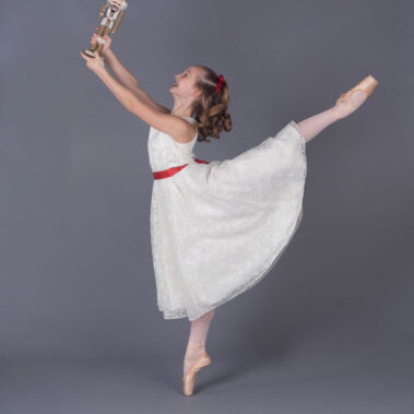 Youth girl posing nutcracker prop