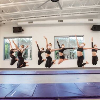 Young ballerina jump up in air