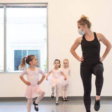 Little Emily with her teach going across the floor, so cute